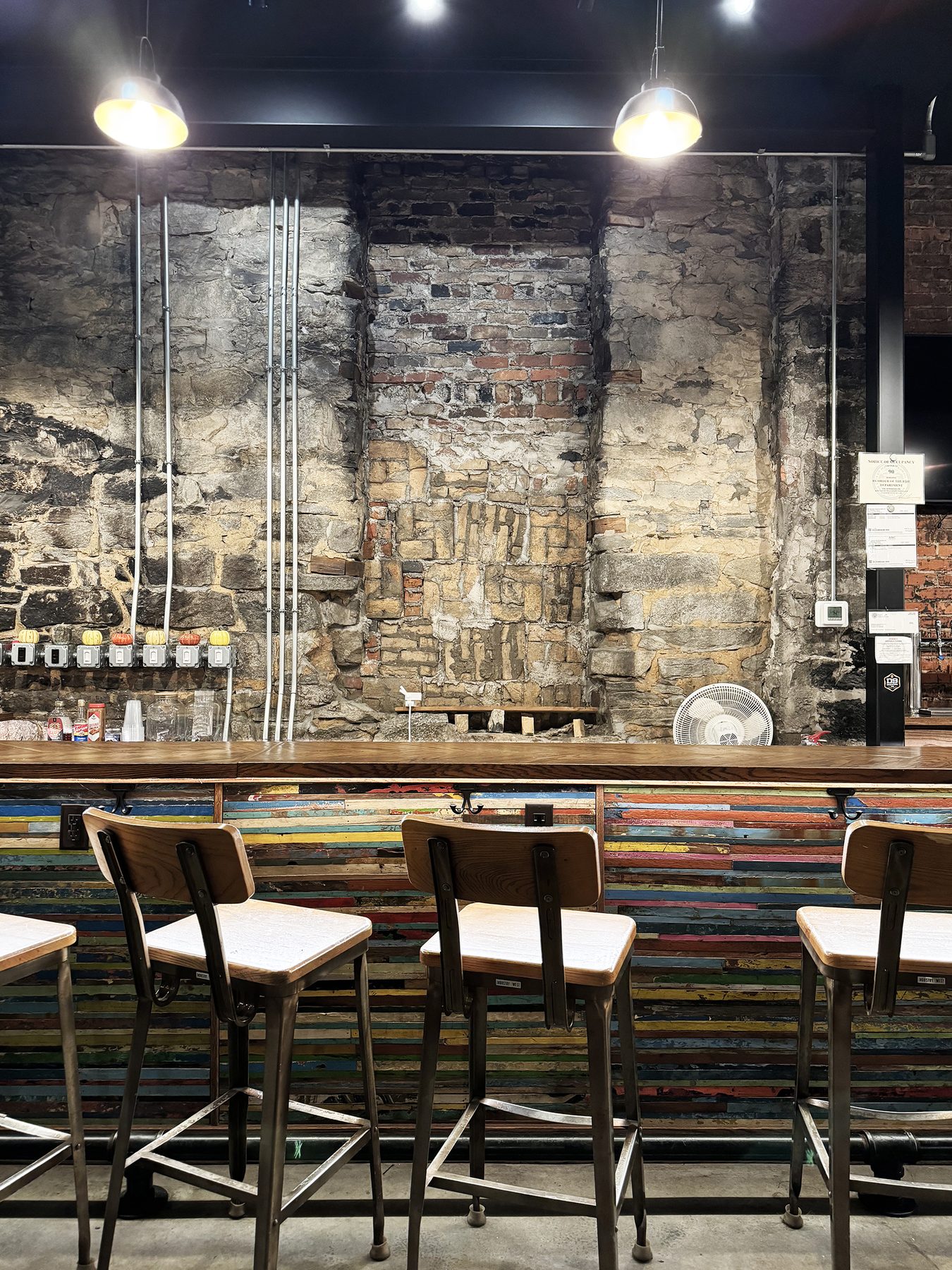 Bar and stone wall